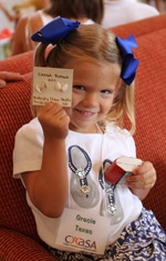 Aboutus_History2 Girl holding up card