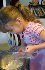 Girl Pouring into Bowl