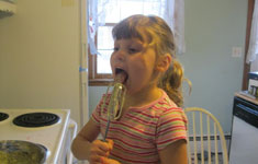 Girl Eating Batter