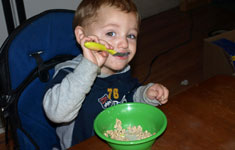 EATING-3 Boy Eating Out of Green Bowl