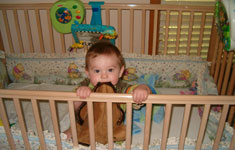 Baby Standing in Crib