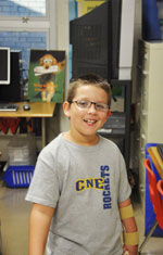 SCHOOL-504-2 Smiling Boy in Classroom