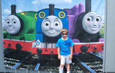 SCHOOLSECT-IEP Boy in front of trains