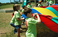 SCHOOLSECT-SPECIAL-EDUCATION Kids playing with parachute