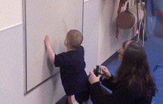 Boy at dry erase board