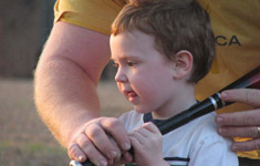 Child learning baseball