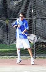 Boy playing tennis