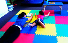 Girl on Tummy Doing Physical Therapy