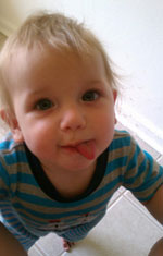 Boy sticking out tongue