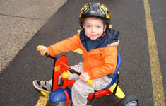 Boy on Tricycle